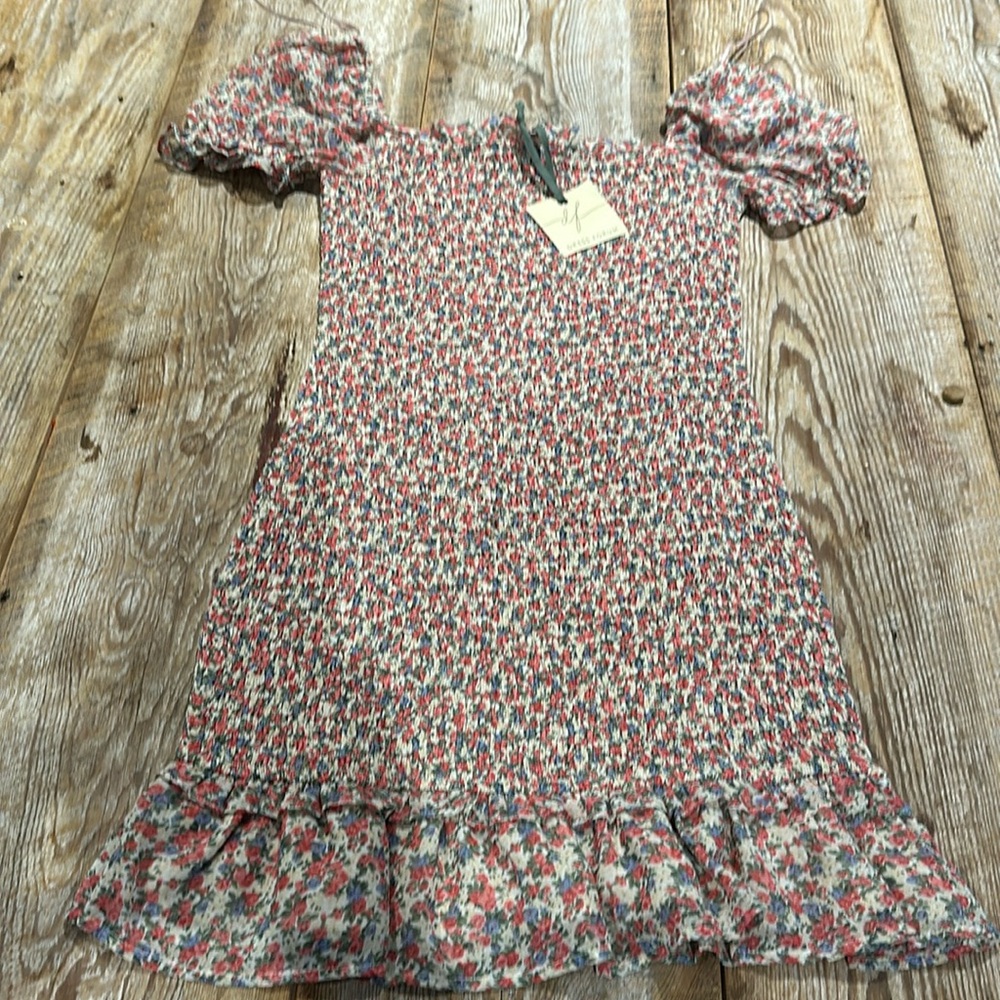 This is a rose garden smoking body mini dress by Nanamacs